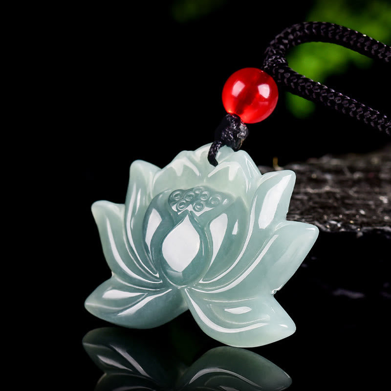 Lotus Flower Carved Jade Prosperity Necklace Pendant - pale green jade lotus bloom, moody dark studio shot, prosperity charm