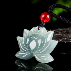 Lotus Flower Carved Jade Prosperity Necklace Pendant - pale green jade lotus bloom, moody dark studio shot, prosperity charm