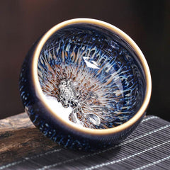 Jianzhan 12 Cup Set - silver koi in blue tenmoku tea bowl, crystalline glaze on wood