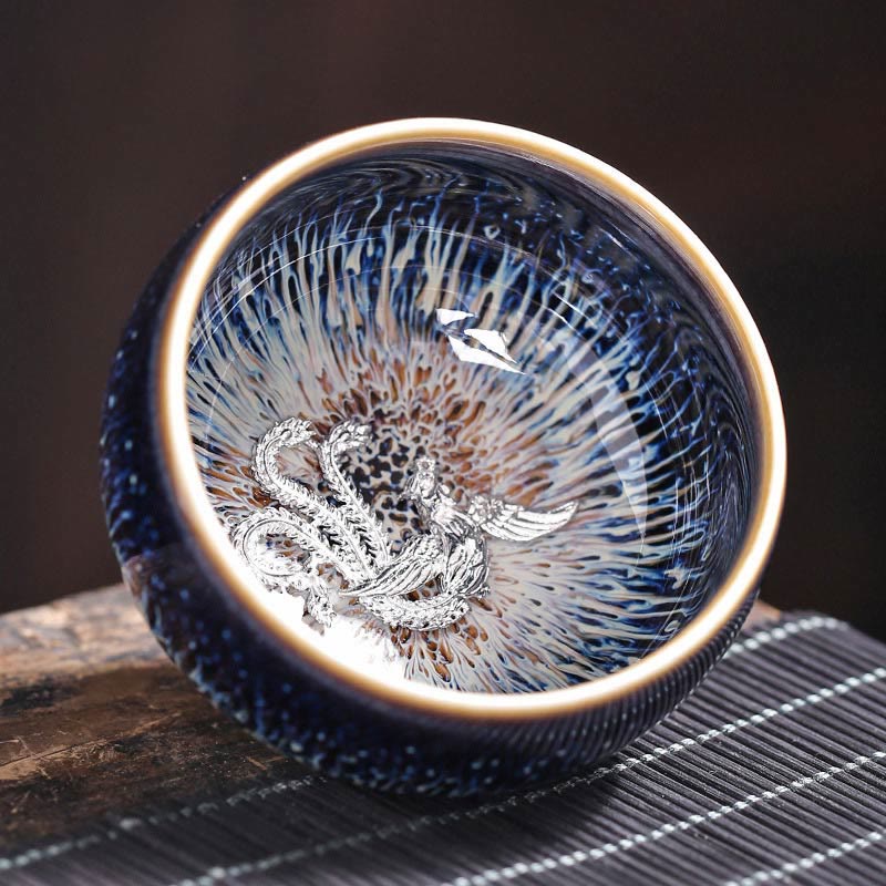 Jianzhan 12 Cup Set - cup with silver turtle ornament, oil-spot glaze on woven tea mat