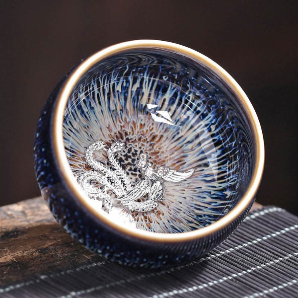 Jianzhan 12 Cup Set - cup with silver turtle ornament, oil-spot glaze on woven tea mat