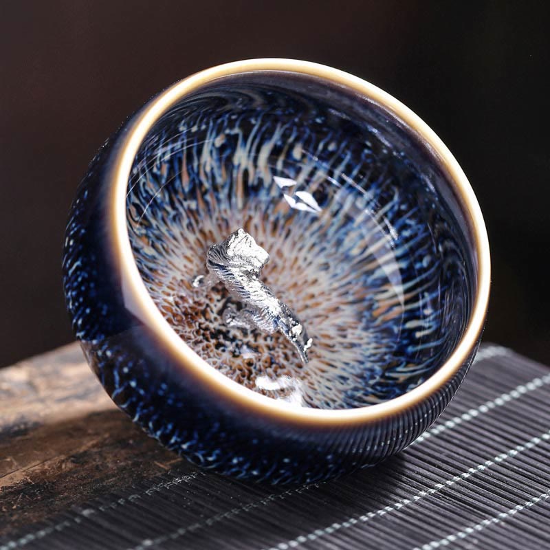 Jianzhan 12 Cup Set - cup with silver lotus inlay, blue oil-spot glaze on wooden tea tray