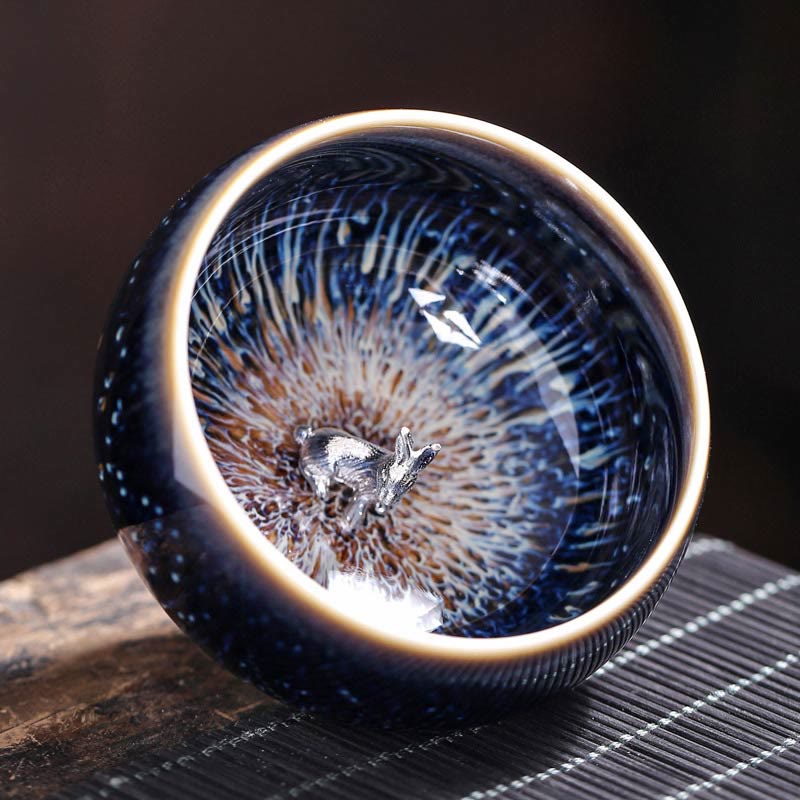 Jianzhan 12 Cup Set - two cups side by side showing contrasting crystalline tenmoku patterns