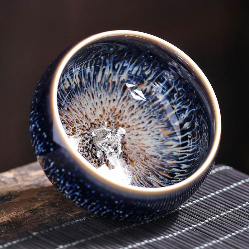 Jianzhan 12 Cup Set - cups nested in gift box compartments, starburst glaze, tenmoku set