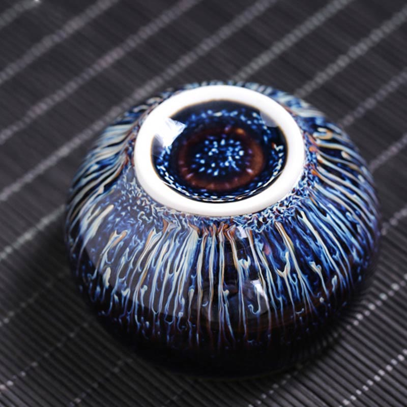 Jianzhan 12 Cup Set - top-down bowl with blue oil-spot glaze and peacock patterns on bamboo