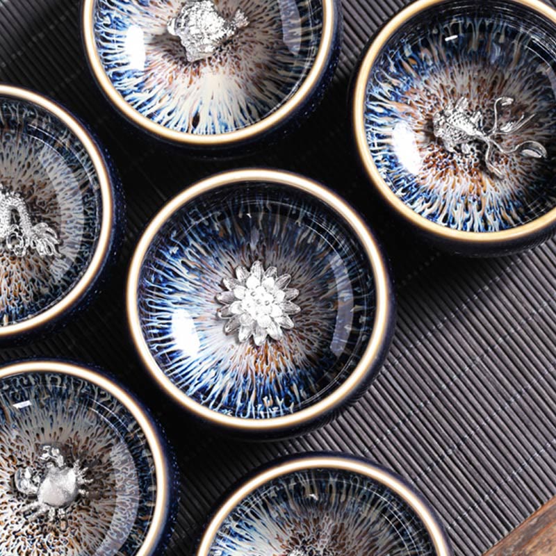 Jianzhan 12 Cup Set - twelve cups in navy drawer gift box with cream dividers on woven mat