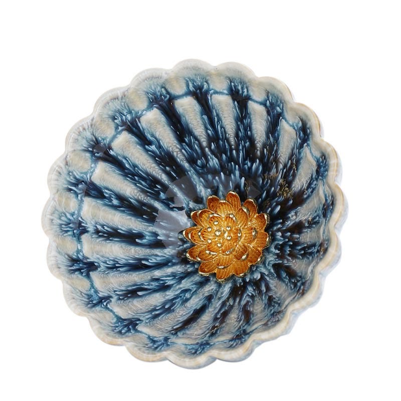 Jianzhan Lotus Ceramic Tea Cup top-down on white with gold lotus center and blue radial glaze