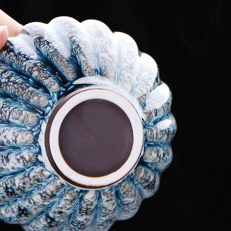 Jianzhan Lotus Ceramic Tea Cup base view revealing unglazed foot ring and blue crystalline glaze