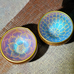 Jianzhan Lotus Tea Cup – pair showing gold lotus and fish-scale patterns, purple-blue iridescent, ceramic