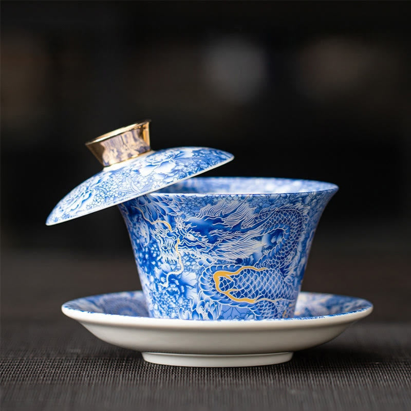 Dunhuang Ceramic Gaiwan Tea Set – Blue-and-white dragon gaiwan with gold accents lid ajar, Imperial Blue
