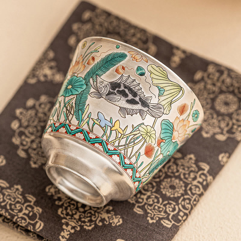 Fish Lotus Tea Cup – hand-painted koi swimming among lotus leaves on cream porcelain, ceramic teacup
