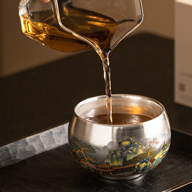 Ceramic Kung Fu Tea Cup Gift Set – Tea poured into silver-lined landscape cup, Active Brewing, Warm Amber