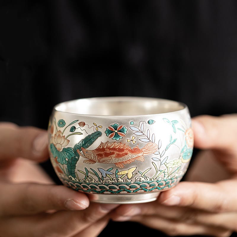 Ceramic Kung Fu Tea Cup Gift Set – Silver cup with koi fish and lotus enamel, held in hands, Luxury Craft