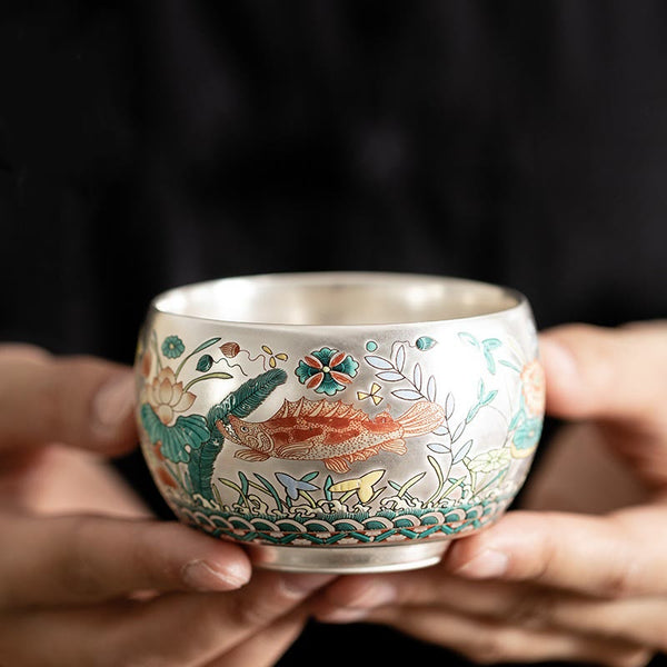 Ceramic Kung Fu Tea Cup Gift Set – Silver cup with koi fish and lotus enamel, held in hands, Luxury Craft