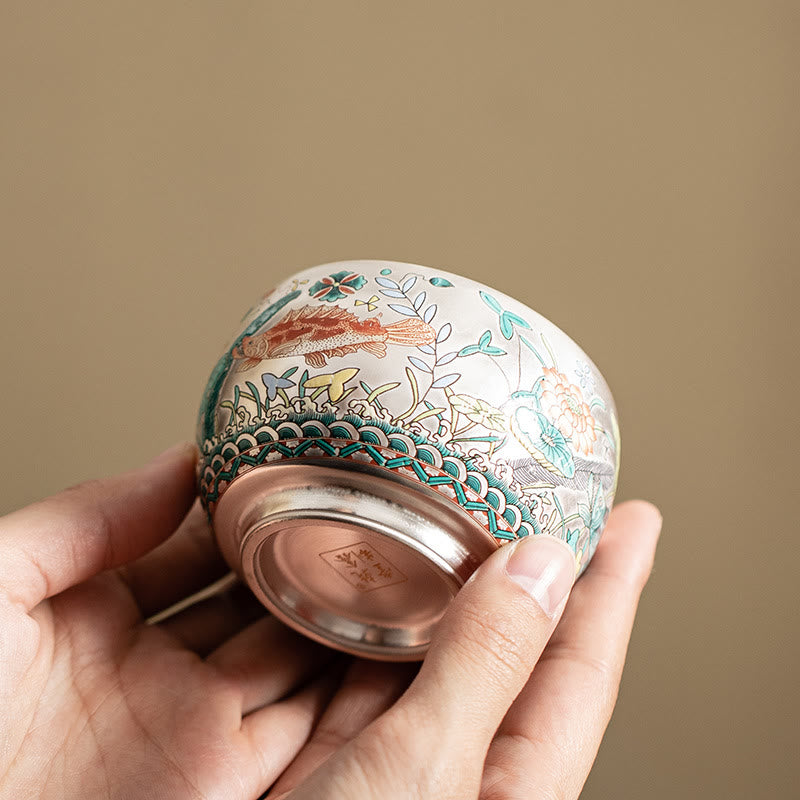 Ceramic Kung Fu Tea Cup Gift Set – Low-angle cup held in hands showing koi and wave base, Copper Foot Ring
