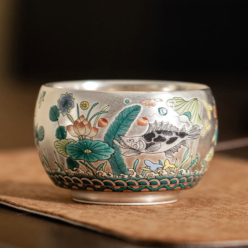 Ceramic Kung Fu Tea Cup Gift Set – Side view of spotted perch cup with lotus on tan surface, Warm Tones