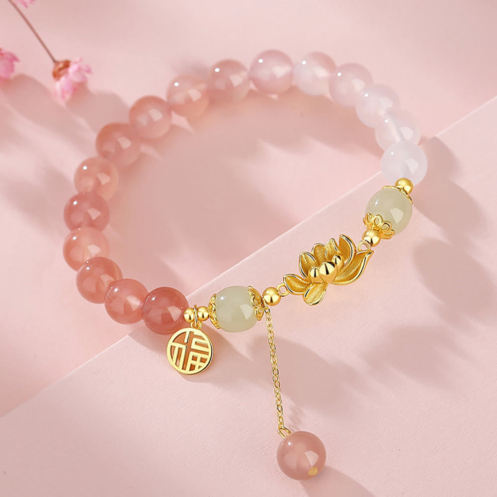 Agate & Hetian Jade Lotus Fu Bracelet – top-down view of pink gradient beads centered with lotus and jade, fortune bracelet