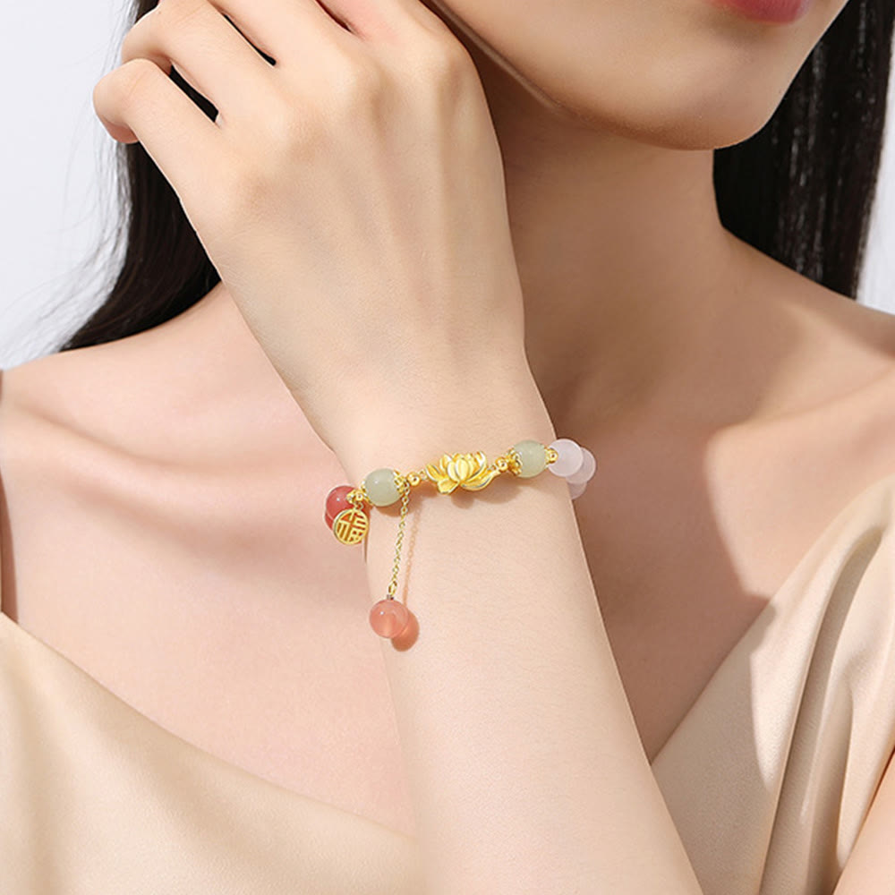 Agate & Hetian Jade Lotus Fu Bracelet – lifestyle wrist shot, gold lotus charm with jade and rose quartz beads on model