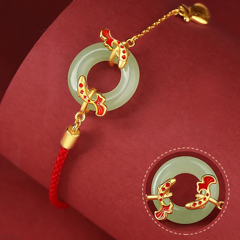 Silver Jade Koi Peace Buckle – worn on model with red cord necklace against plain background