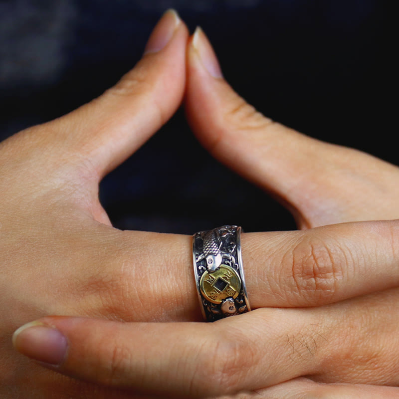 925 Silver Koi Fish Copper Coin Ring – worn on hand prayer gesture, Chinese coin and koi fish, side angle, dark background