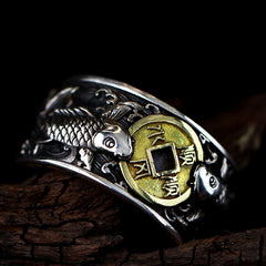 925 Silver Koi Fish Copper Coin Ring – three-quarter angle, twin koi around Chinese cash coin, wave motifs, dark wood