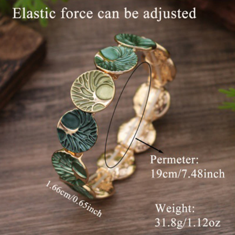 Tree of Life Enamel Alloy Bracelet – green bracelet with size annotations, 19cm perimeter 31.8g on wood