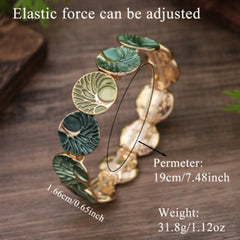 Tree of Life Enamel Alloy Bracelet – green bracelet with size annotations, 19cm perimeter 31.8g on wood