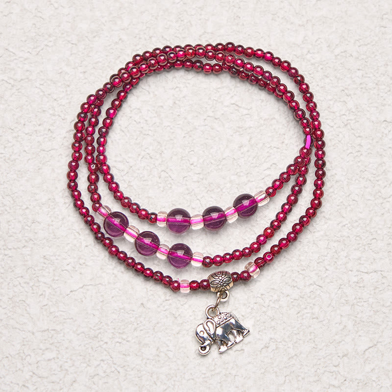 Natural Garnet PiXiu Elephant Abacus Lucky Bag Bracelet – triple wrap on white textured background with elephant, good luck jewelry