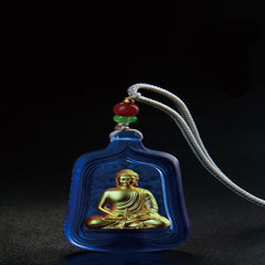 Medicine Buddha Liuli Necklace – pendant glowing in light showing liuli glass inner depth