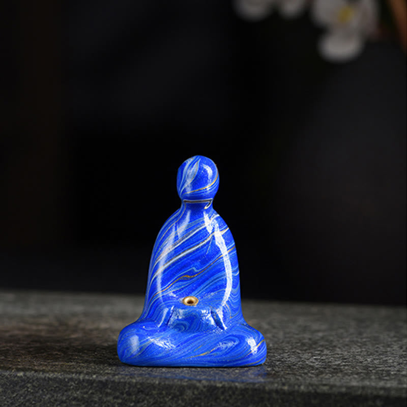 Mini Formless Buddha Incense Holder – Buddha figure glowing in soft candlelight ambiance