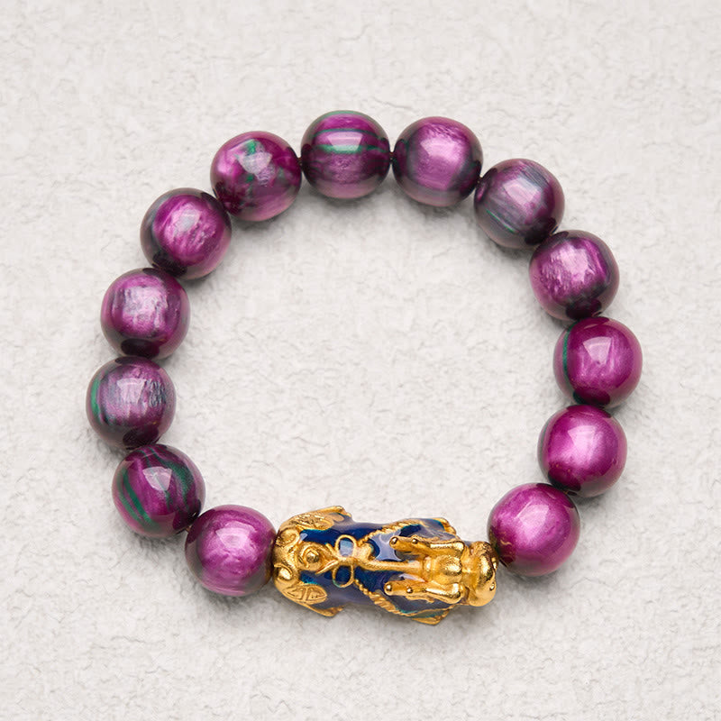 Purple sea willow bracelet on light textured surface, top view
