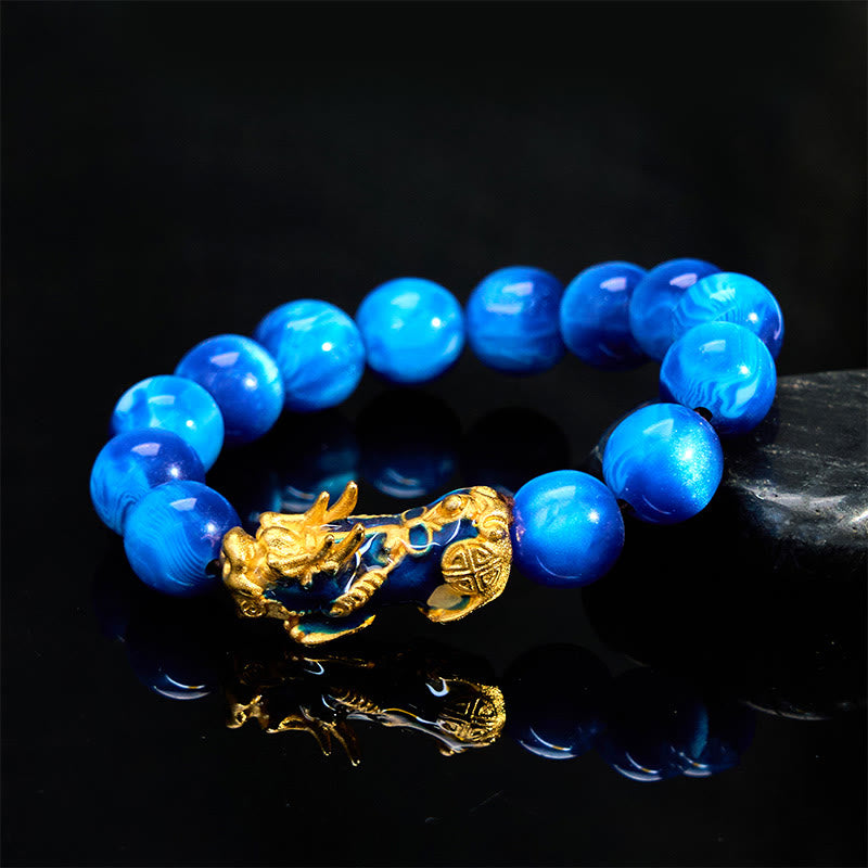 Colorful Sea Willow Pixiu Bracelet – blue beads on black reflective surface, sea willow
