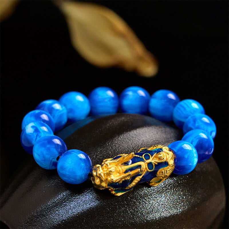 Colorful Sea Willow Pixiu Bracelet – blue beads on black stone close-up Pixiu, protection