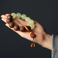 Sappan Wood Engraved Pixiu Fu Bracelet – palm display on dark background with gourd pendants, healing spiritual jewelry