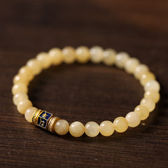 Om Mani Padme Hum Bracelet – Circular layout on dark wood highlighting blue enamel focal charm, Buddhist mala