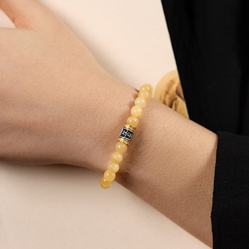 Om Mani Padme Hum Bracelet – Side wrist view showing top of hand with beaded stretch bracelet, casual wear