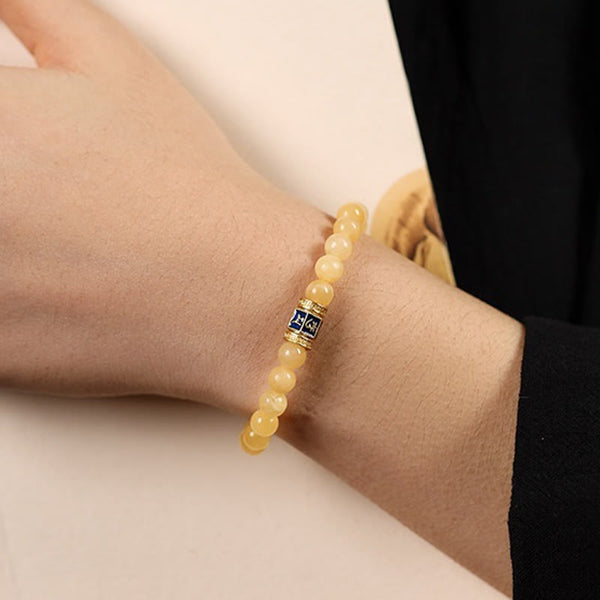 Om Mani Padme Hum Bracelet – Side wrist view showing top of hand with beaded stretch bracelet, casual wear