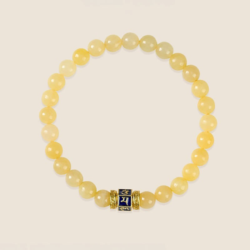 Om Mani Padme Hum Bracelet – Overhead view of round beaded bracelet with mantra bead, clean white backdrop