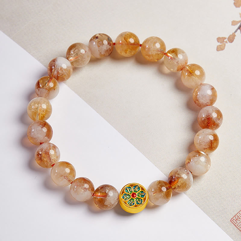 999 Sterling Silver Citrine Om Mani Padme Hum Bracelet – three-quarter view on dual-tone background with traditional Asian art, visible red cord and Sanskrit mantra bead