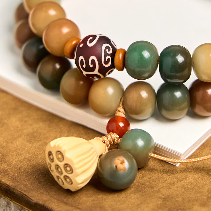 Colorful Bodhi Seed Lotus Pod Double Wrap Bracelet – warm-toned seed beads with gold-knotted lotus tassel, wisdom