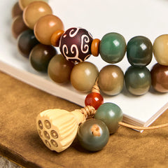 Colorful Bodhi Seed Lotus Pod Double Wrap Bracelet – warm-toned seed beads with gold-knotted lotus tassel, wisdom