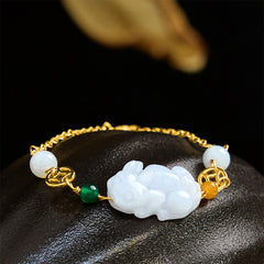 Natural Jade PiXiu Bracelet – white jade Pixiu gold chain green bead black background, luck wealth feng shui