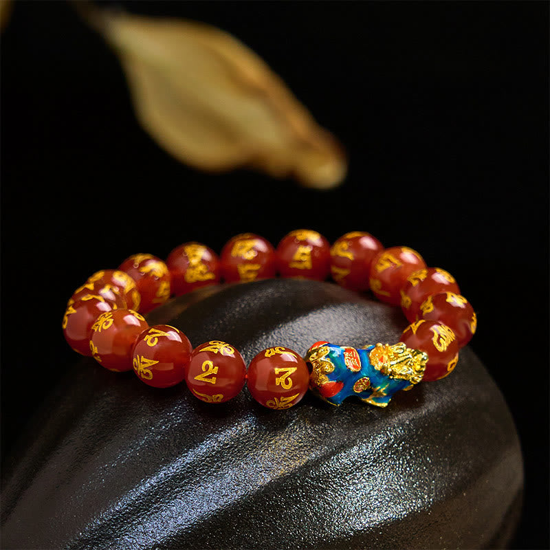 Red Agate PiXiu Color Change Bracelet Om Mani Padme Hum – bracelet on black stone with golden leaf accent, spiritual good luck