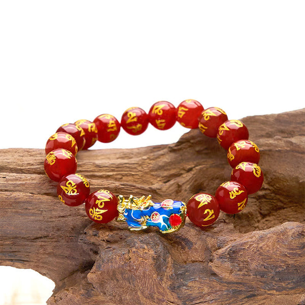 Red Agate PiXiu Color Change Bracelet Om Mani Padme Hum – side view on natural wood rock white backdrop, agate wealth bracelet