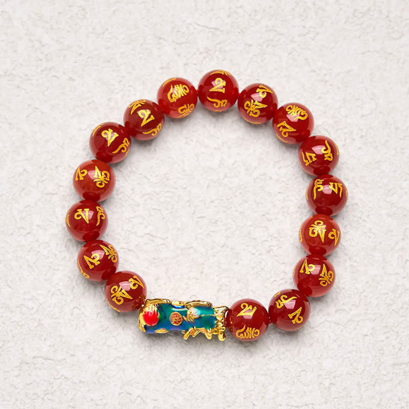 Red Agate PiXiu Color Change Bracelet Om Mani Padme Hum – top down view on white texture with blue enamel Pi Xiu, calm healing
