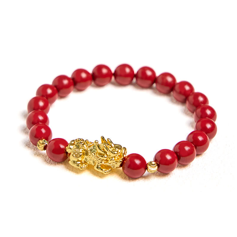 Cinnabar Pixiu Calm Bracelet – clean product shot on white background showing single strand red cinnabar beads with gold Pixiu, good luck