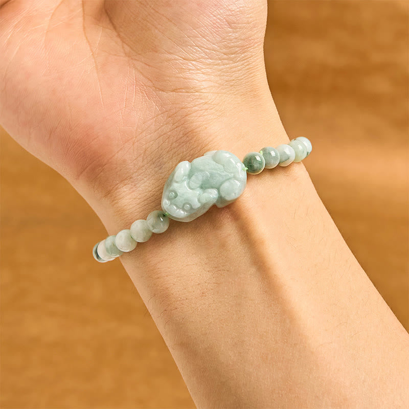 Natural Green Jade Pixiu Carved Luck Bead Bracelet – worn on wrist showing carved green jade Pixiu and bead detail, prosperity jewelry