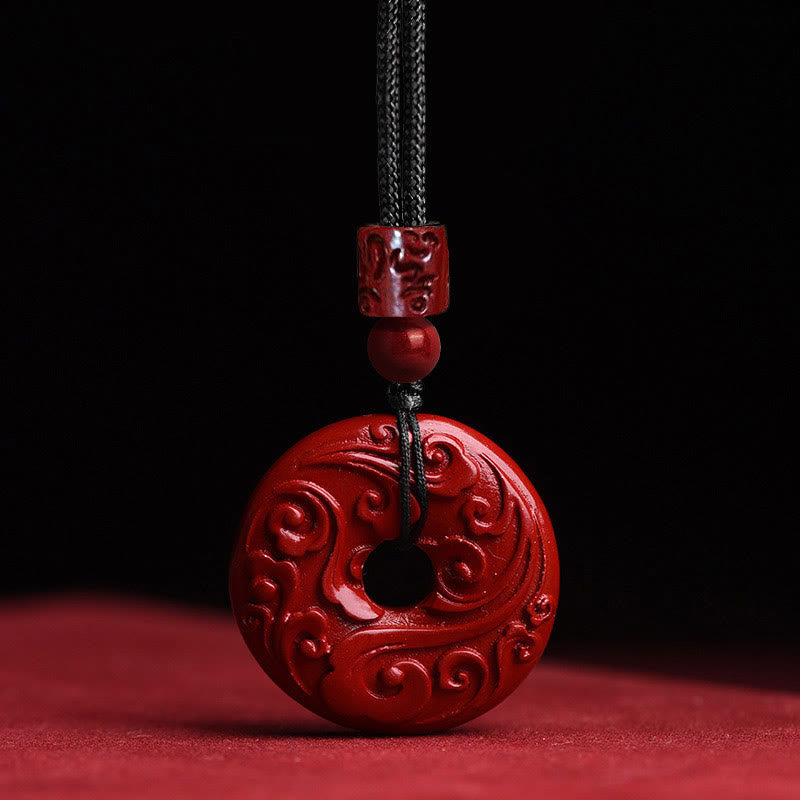 Cinnabar Lotus Peace Buckle Necklace - single red bi-disc pendant with cloud carvings on black cord, Bold