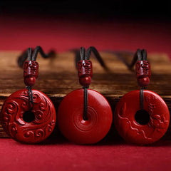 Cinnabar Lotus Peace Buckle Necklace - three pendant design variations showing carved motifs, Artisanal