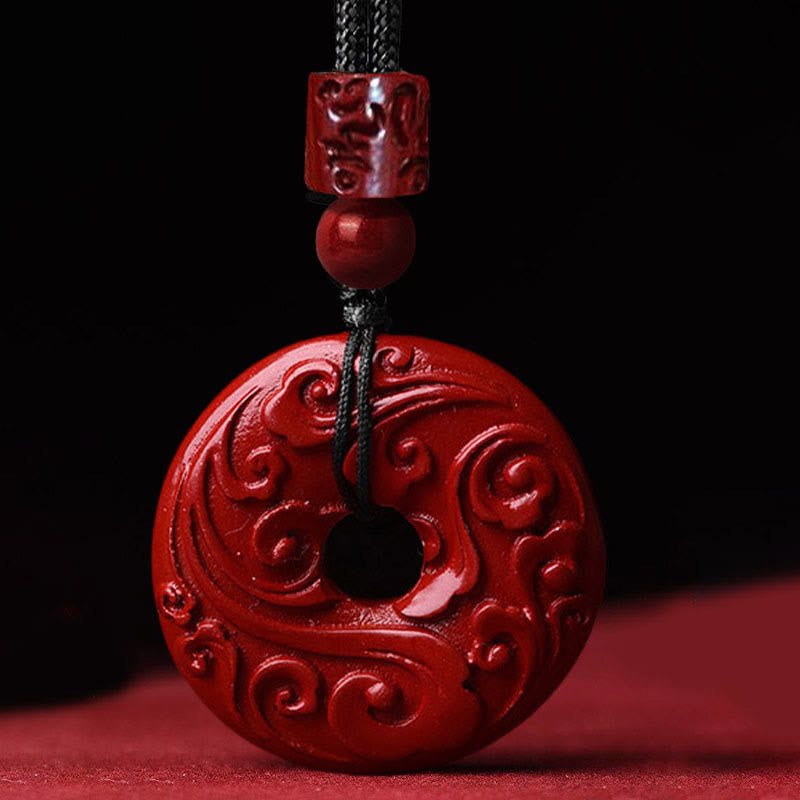 Cinnabar Lotus Peace Buckle Necklace - close-up of swirling cloud carved relief on red disc, Intricate